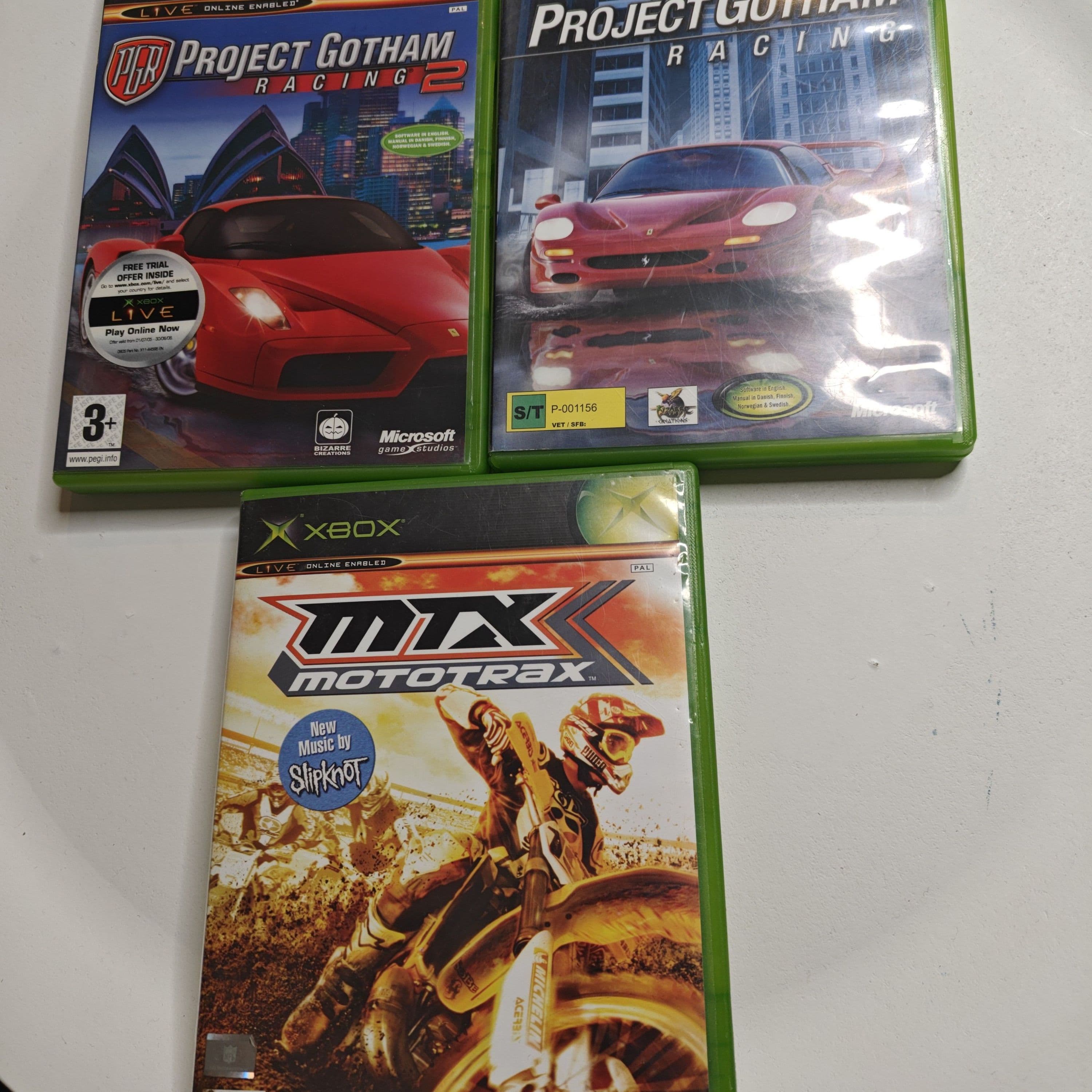 Bundle of three original Xbox consoles listed for sale