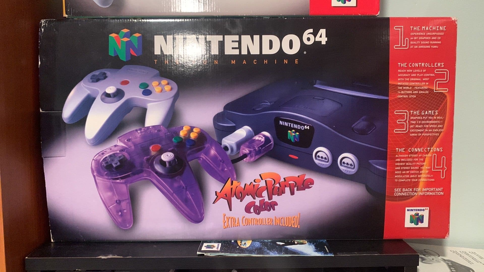 Atomic Purple translucent Nintendo 64 console in box